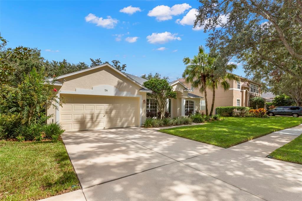 734 Berry Bramble Drive Brandon, FL 33510 - Photo 5 of 49 a front view of a house with a yard