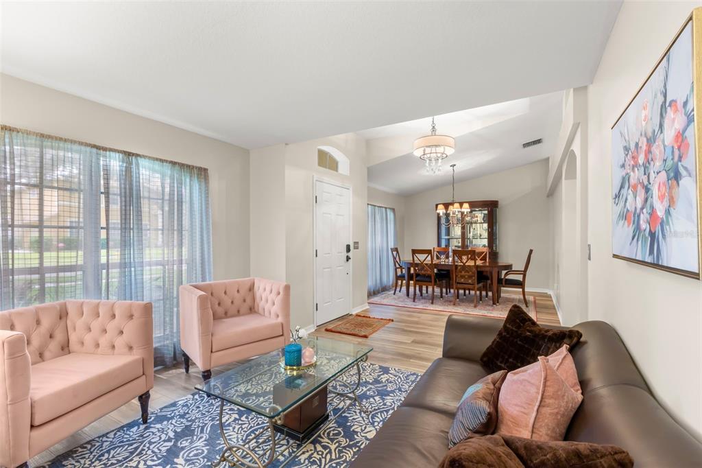 734 Berry Bramble Drive Brandon, FL 33510 - Photo 9 of 49 a living room with furniture and a large window