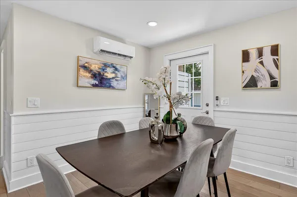 a view of a dining room with furniture and window