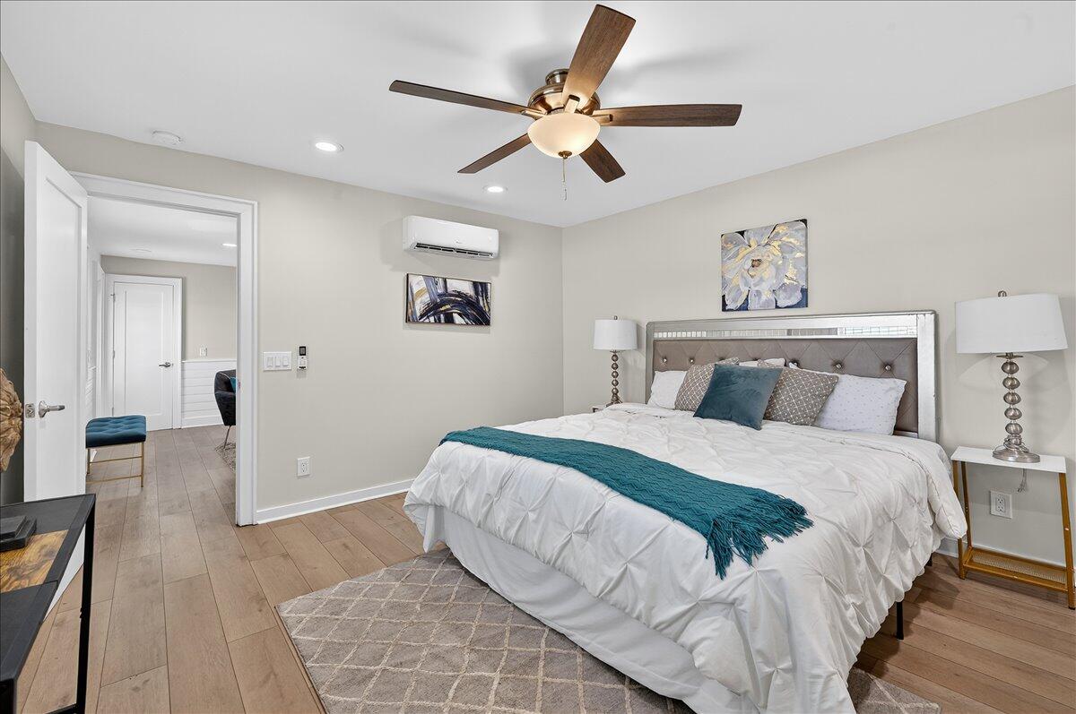 262 Easy Street Sebastian, FL 32958 - Photo 18 of 36 a bedroom with a bed and a ceiling fan