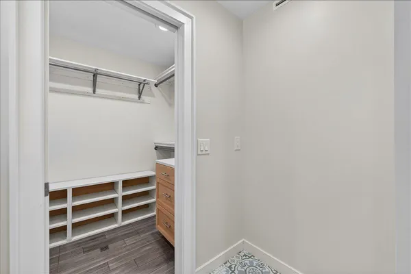 a view of closet area with empty racks