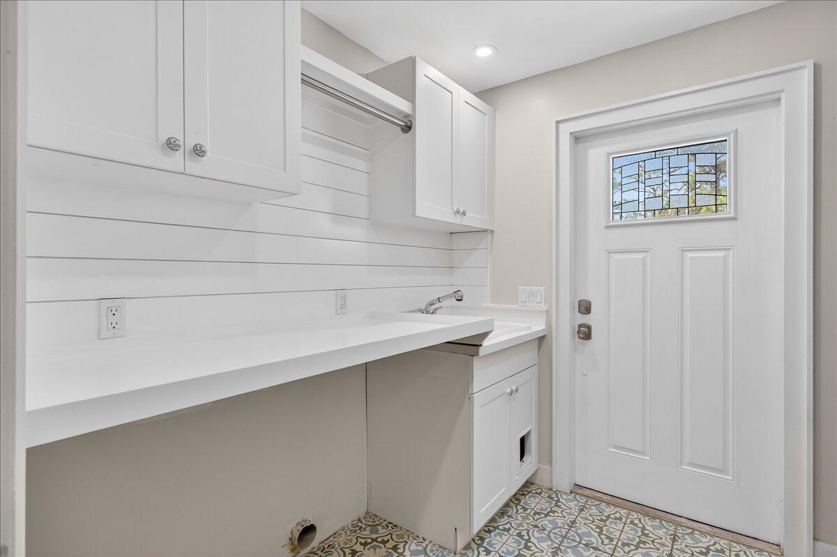 262 Easy Street Sebastian, FL 32958 - Photo 28 of 36 a room with cabinets and a wooden floors