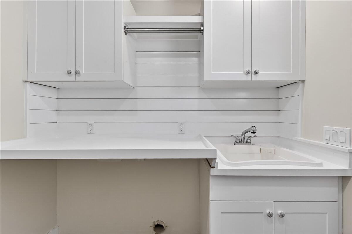262 Easy Street Sebastian, FL 32958 - Photo 29 of 36 a bathroom with a sink and cabinets