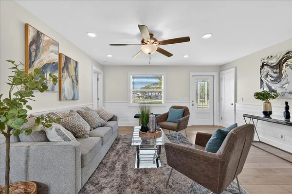 a living room with furniture and a large window