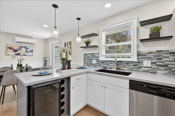 a kitchen with a sink stove and cabinets