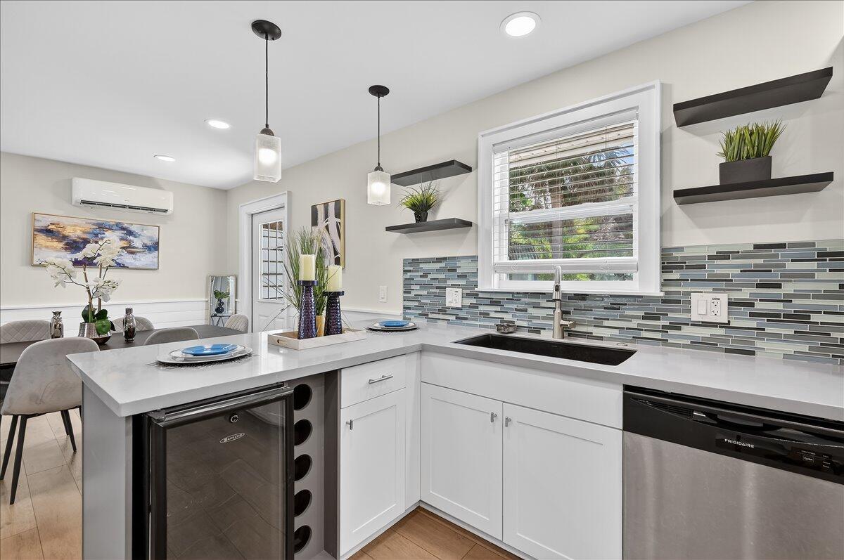 262 Easy Street Sebastian, FL 32958 - Photo 10 of 36 a kitchen with a sink stove and cabinets