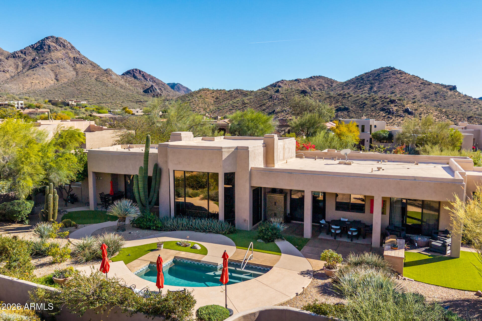 10801 East Happy Valley Road, Unit 24 Scottsdale, AZ 85255 - Photo 1 of 35 a view of a house with swimming pool and a chairs