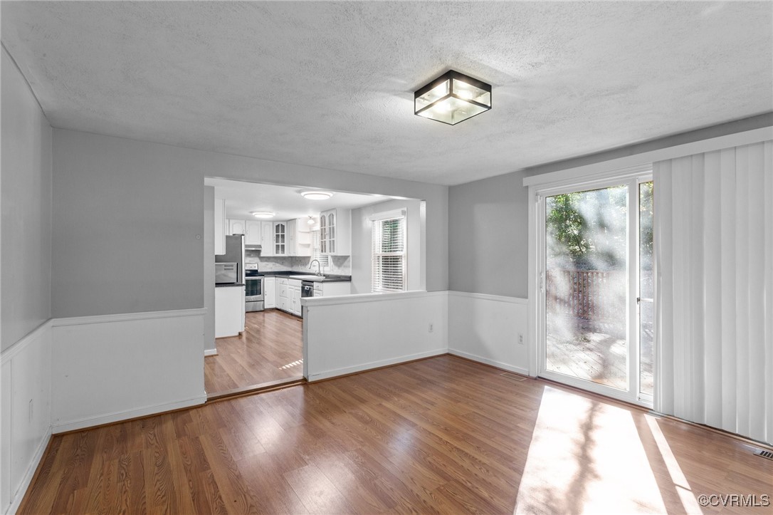 1200 Oldbury Road Midlothian, VA 23113 - Photo 21 of 42 a view of a living room with hardwood floor and a large window