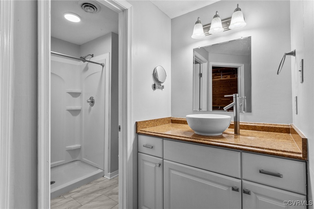 1200 Oldbury Road Midlothian, VA 23113 - Photo 28 of 42 a bathroom with a granite countertop sink and a mirror