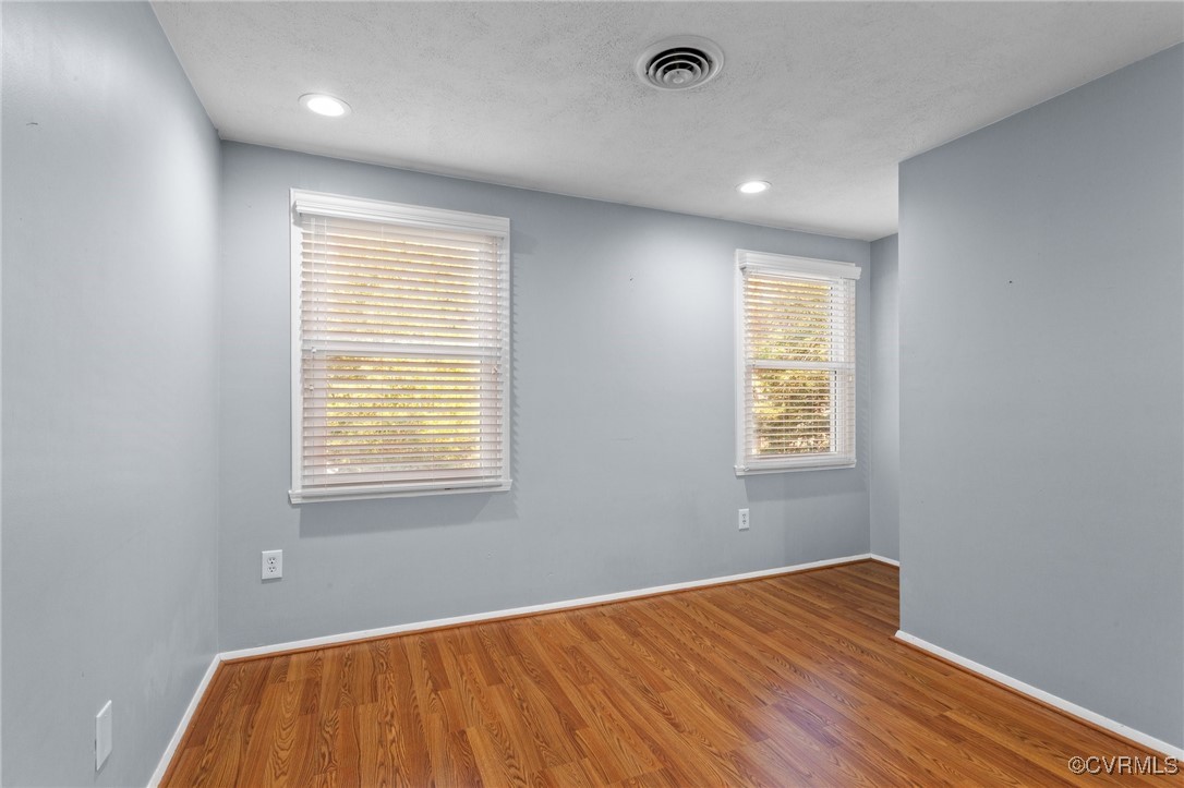 1200 Oldbury Road Midlothian, VA 23113 - Photo 30 of 42 a view of an empty room with wooden floor and a window