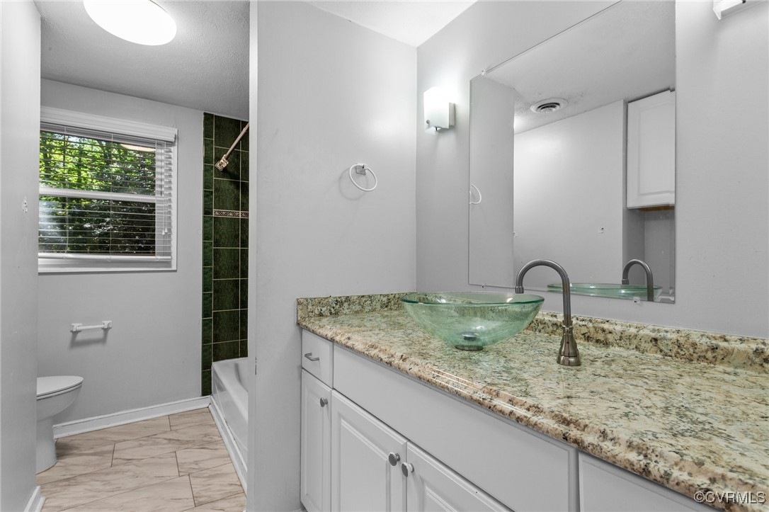 1200 Oldbury Road Midlothian, VA 23113 - Photo 3 of 42 a bathroom with a granite countertop sink a toilet and a large mirror