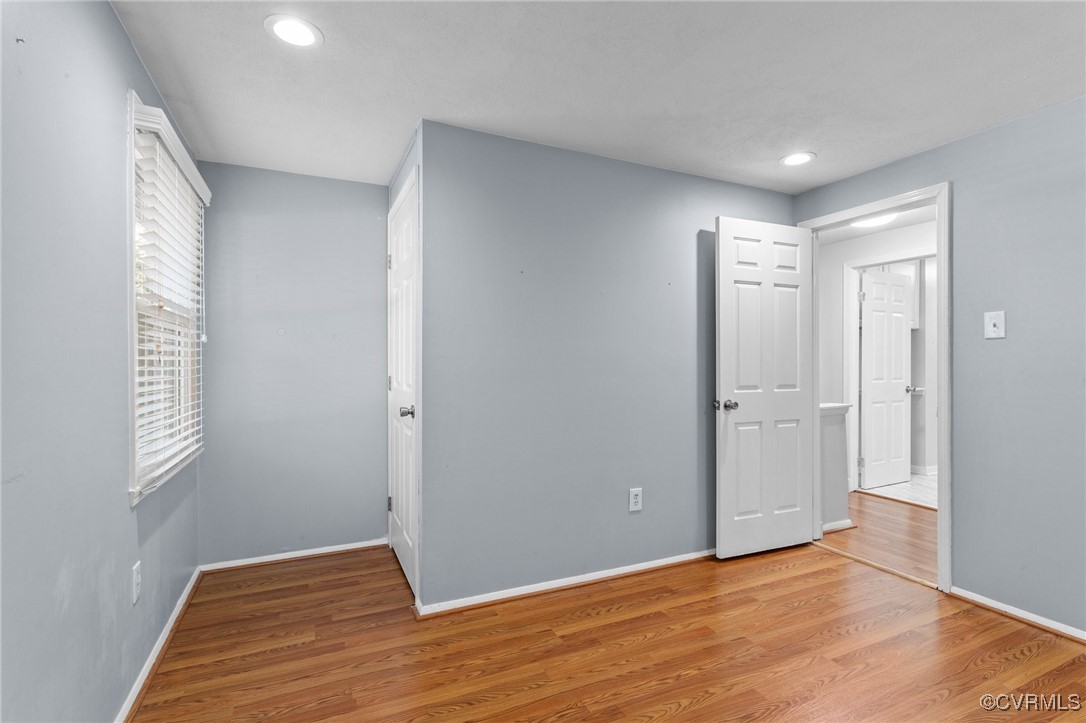 1200 Oldbury Road Midlothian, VA 23113 - Photo 31 of 42 a view of an empty room with wooden floor and window