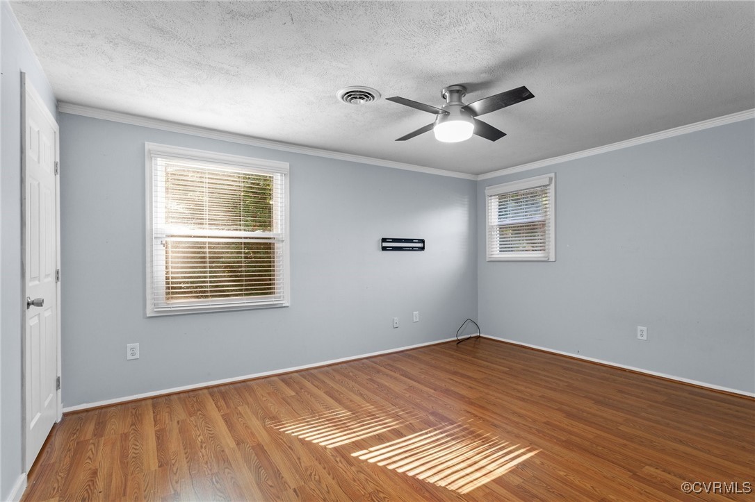 1200 Oldbury Road Midlothian, VA 23113 - Photo 33 of 42 a view of empty room with wooden floor and fan