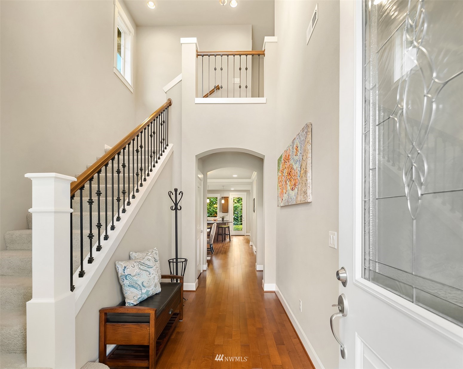 6311 Southeast 2nd Street Renton, WA 98059 - Photo 2 of 22 a view of a hallway with wooden floor and staircase