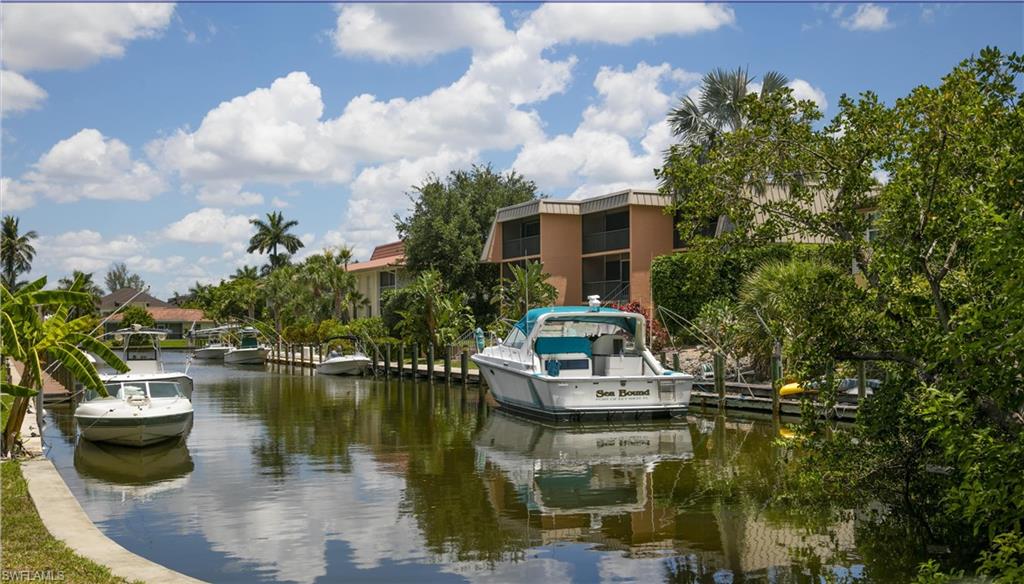 1555 Blue Point Avenue, Unit 3 Naples, FL 34102 - Photo 6 of 9 View of water feature featuring a dock