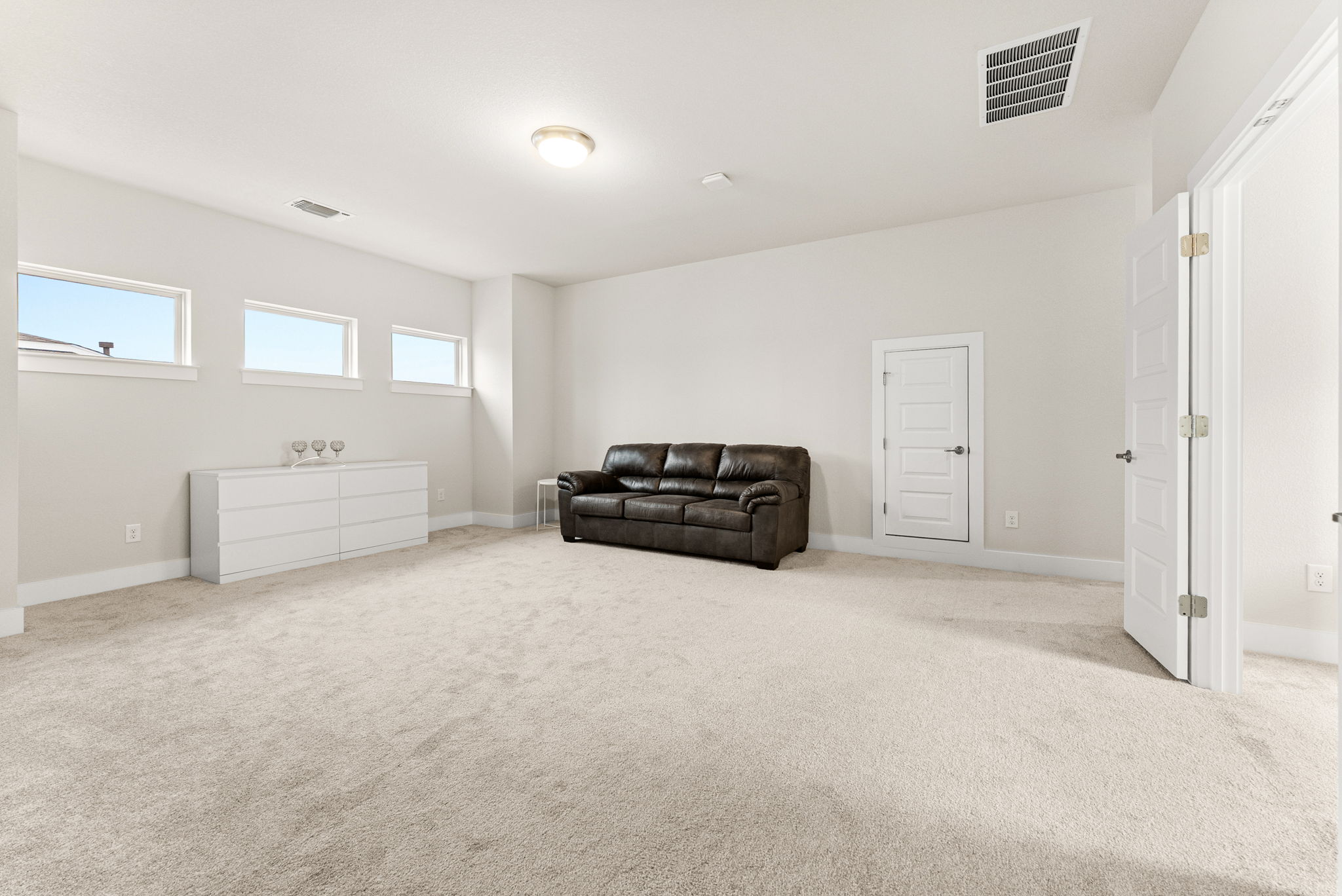 9508 Hamadryas Drive Austin, TX 78744 - Photo 27 of 40 The large game room is the focal point of the second floor.