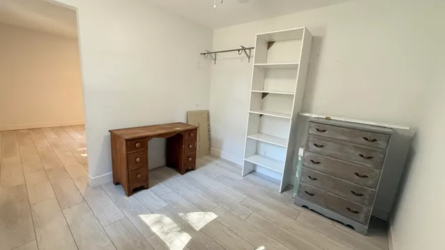 a view of hallway with natural light