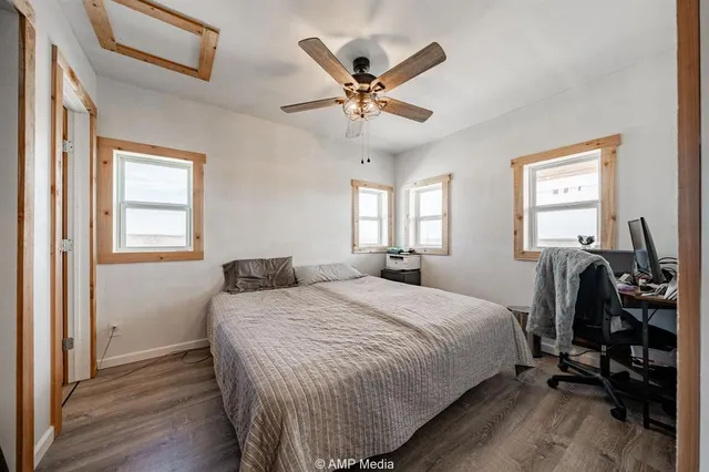 a bedroom with a bed and window