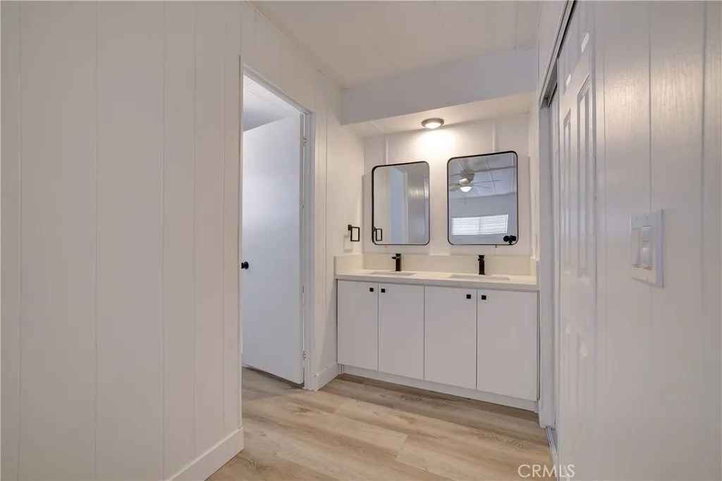 3700 Buchanan Street, Unit 164 Riverside, CA 92503 - Photo 29 of 40 a spacious bathroom with a double vanity sink and mirror