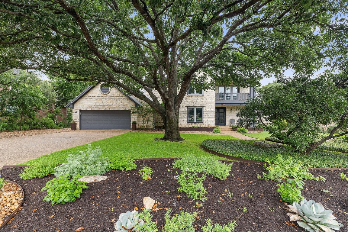 2704 Bartons Bluff Lane Austin, TX 78746 - Photo 1 of 1 a front view of a house with garden