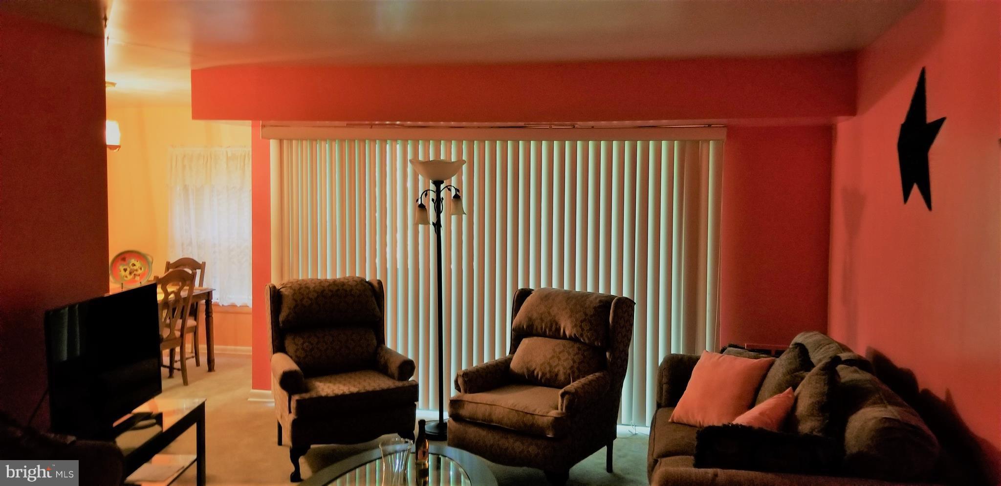 3863 St Barnabas Road, Unit T Suitland, MD 20746 - Photo 2 of 6 a living room with furniture and a window