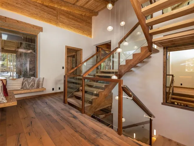 a view of entryway livingroom and hall with wooden floor