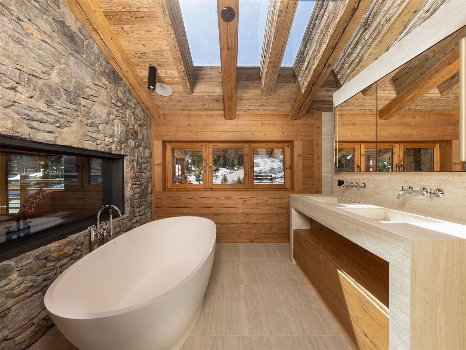 256 Timbertrail Road Breckenridge, CO 80424 - Photo 18 of 31 a bathroom with a sink a large mirror and bathtub