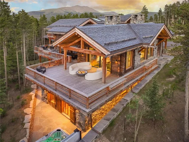 an aerial view of houses with a table and chairs