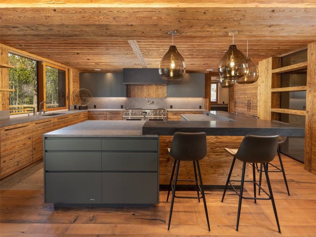 256 Timbertrail Road Breckenridge, CO 80424 - Photo 29 of 31 a kitchen with a sink cabinets and wooden floor