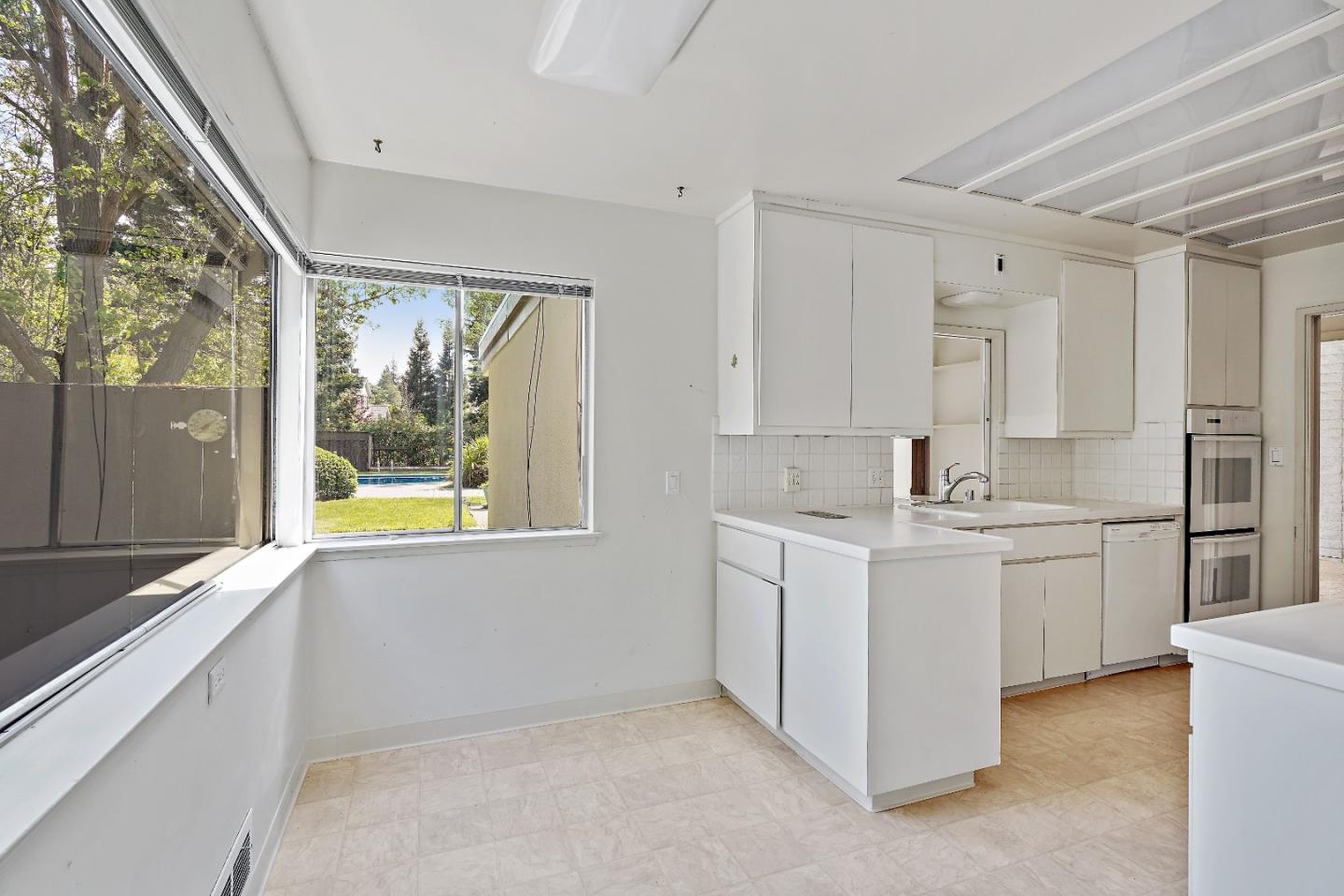 80 Gresham Lane Atherton, CA 94027 - Photo 11 of 30 a bathroom with a granite countertop sink mirror and window