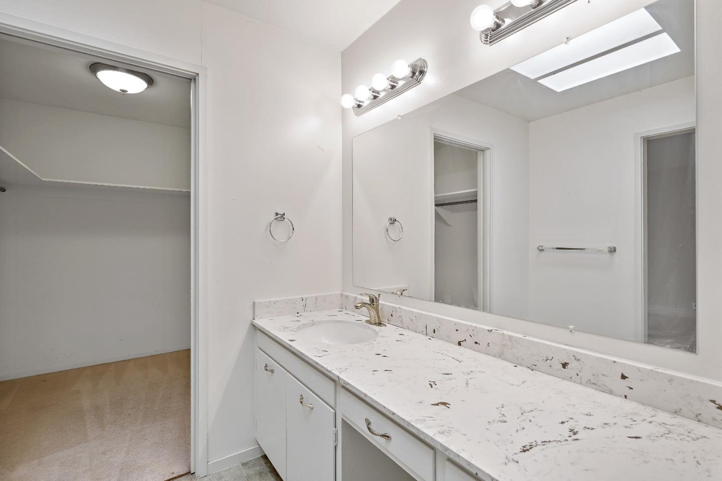 80 Gresham Lane Atherton, CA 94027 - Photo 20 of 30 a bathroom with a granite countertop sink and a mirror