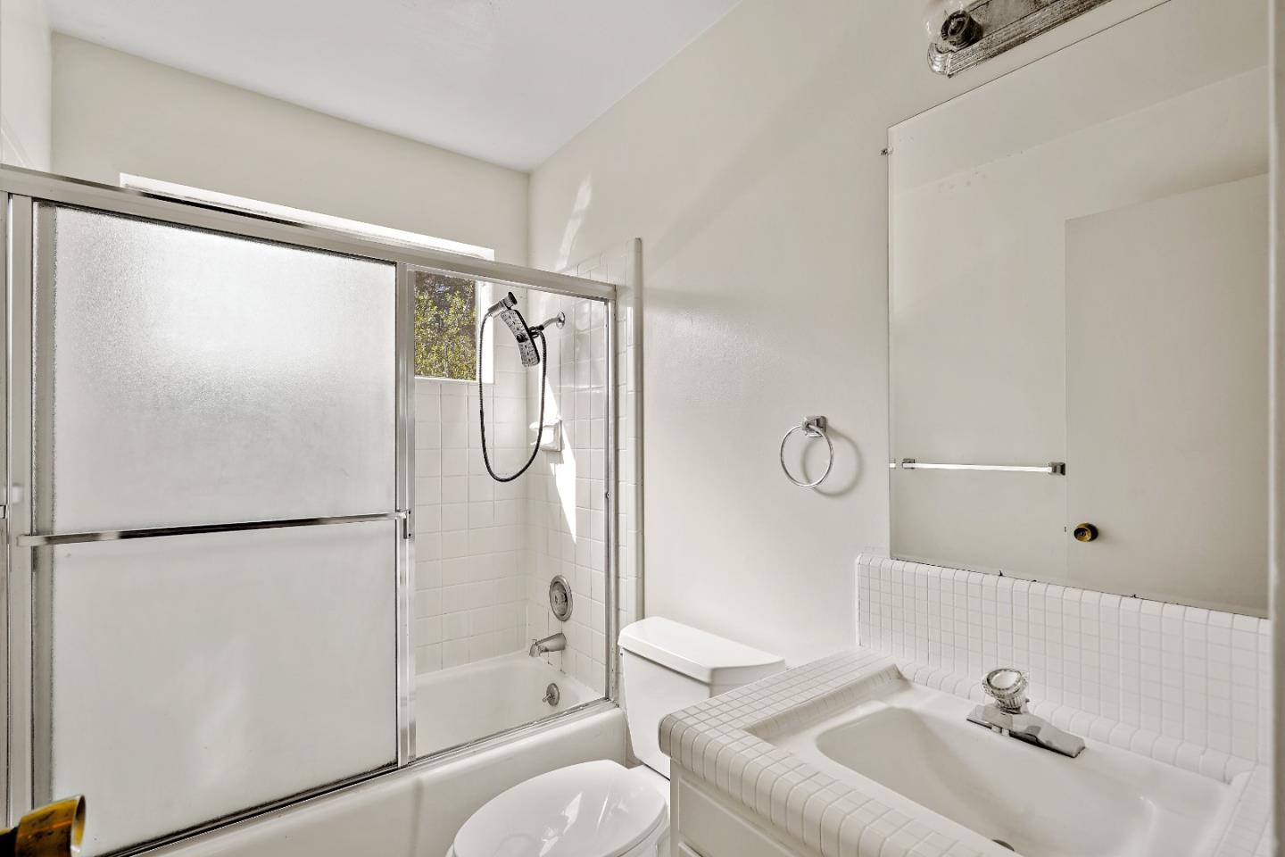 80 Gresham Lane Atherton, CA 94027 - Photo 24 of 30 a bathroom with a shower sink vanity mirror and toilet