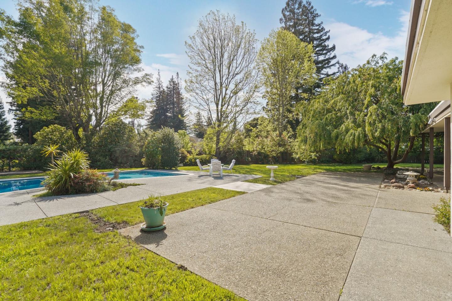 80 Gresham Lane Atherton, CA 94027 - Photo 25 of 30 a view of a swimming pool with an outdoor space and seating area
