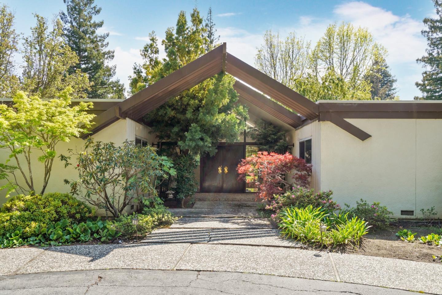 80 Gresham Lane Atherton, CA 94027 - Photo 3 of 30 a front view of a house with a yard and flowers