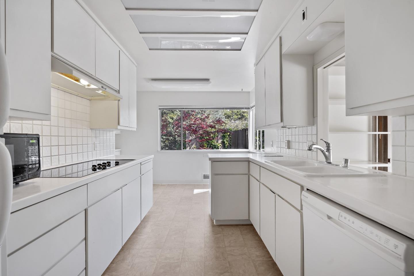80 Gresham Lane Atherton, CA 94027 - Photo 10 of 30 a kitchen with a sink stove and cabinets