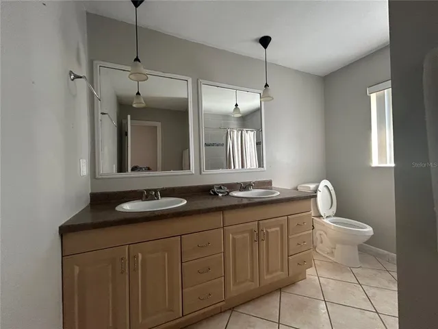 a bathroom with a shower and a mirror