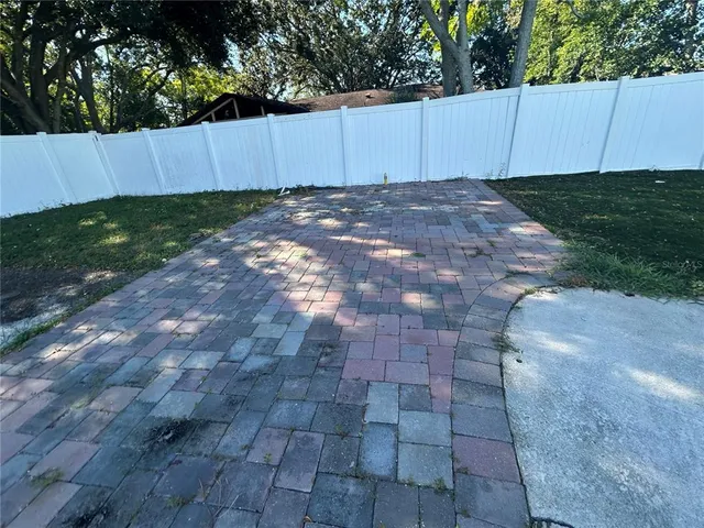 a view of a backyard with a small pool