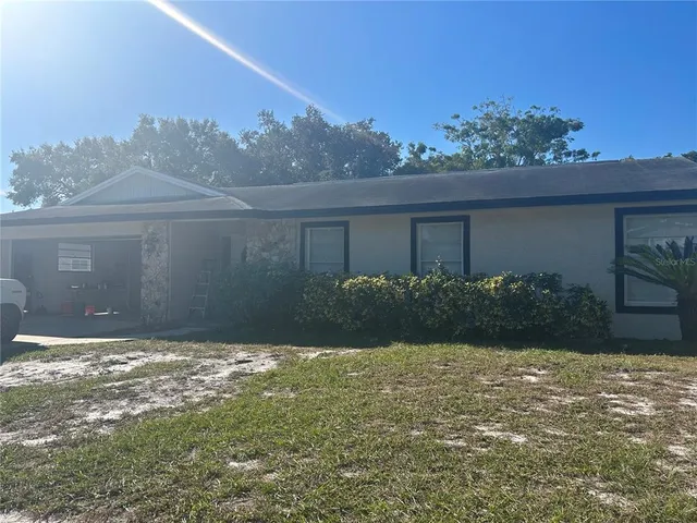 a view of a back yard of a house