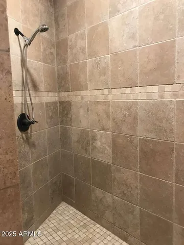 a kitchen with a granite countertop sink and refrigerator
