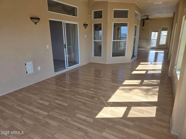 a view of an empty room with a large window