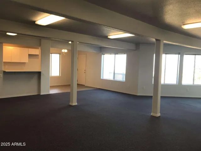 a kitchen with white cabinets white stainless steel appliances and sink