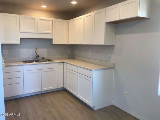 a view of an empty room and a window