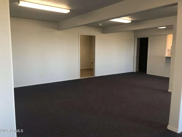 a utility room with a sink a mirror and vanity