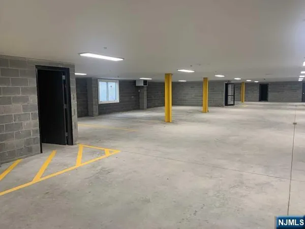 a view of a hall with a fireplace