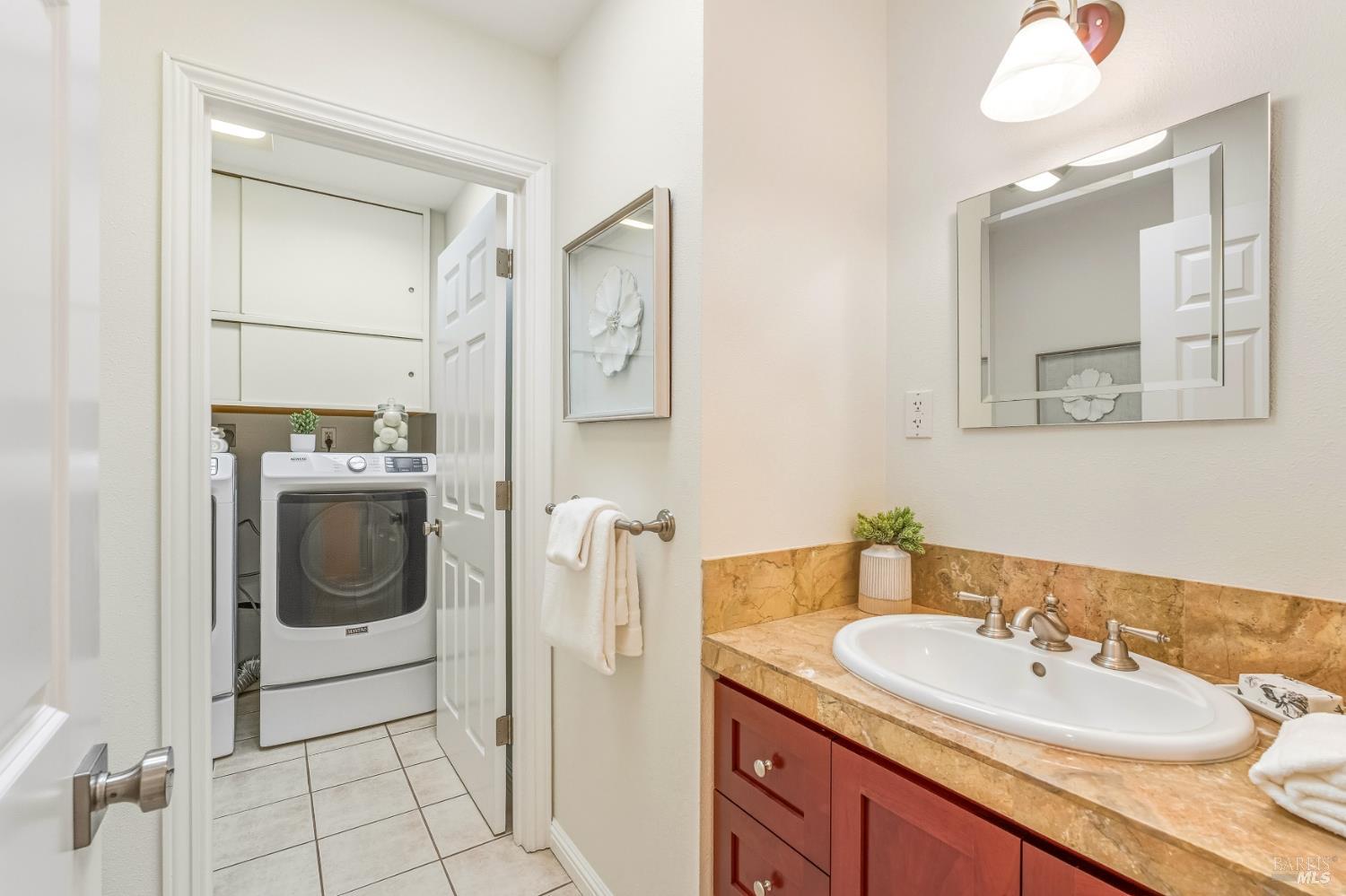 829 Las Pavadas Avenue San Rafael, CA 94903 - Photo 44 of 55 Convenient powder room with granite topped vanity and skylight (laundry beyond)...