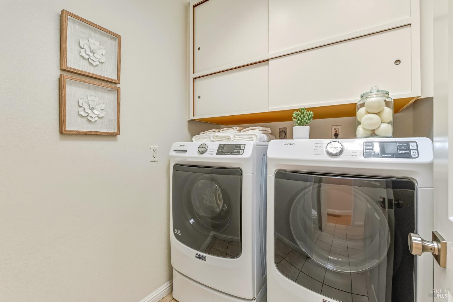 829 Las Pavadas Avenue San Rafael, CA 94903 - Photo 45 of 55 The laundry room has storage cabinets and a skylight above...