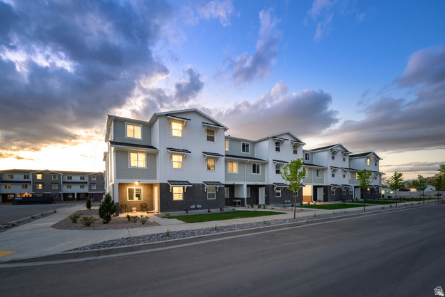 640 Empress Street, Unit 31 Santaquin, UT 84655 - Photo 1 of 10 Modern townhome exteriors featuring light siding, dark-toned lower level accents, and multiple windows