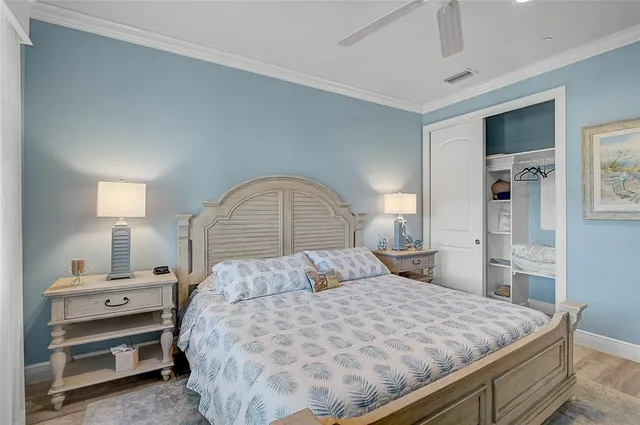 a view of a hallway with wooden floor and a mirror