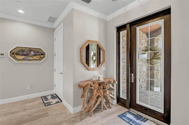 a living room with furniture a rug and a clock