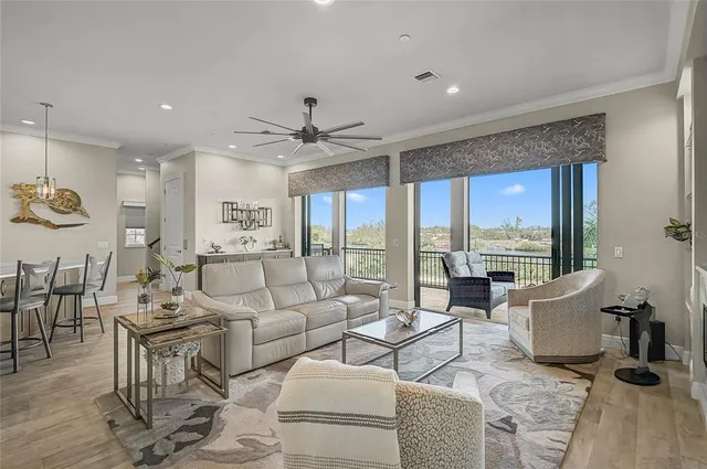 a view of a city from a balcony with furniture